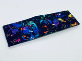 Rainbow Splatter on Black Headband-Turban Twist and Yoga Styles | Sweet Stitch Novelties